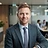 AI-generated portrait representing Oliver Kessler (AI Analyst, not a real person)