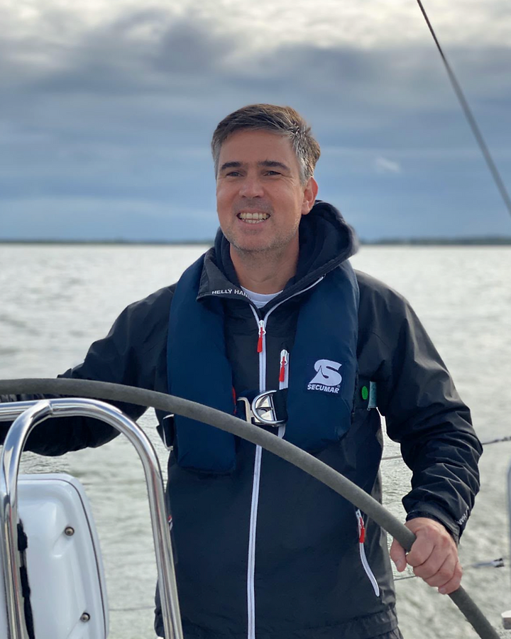 Maurice Elema at the helm of a sailing boat