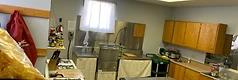 Wide view from the cooking area toward the dishwashing station