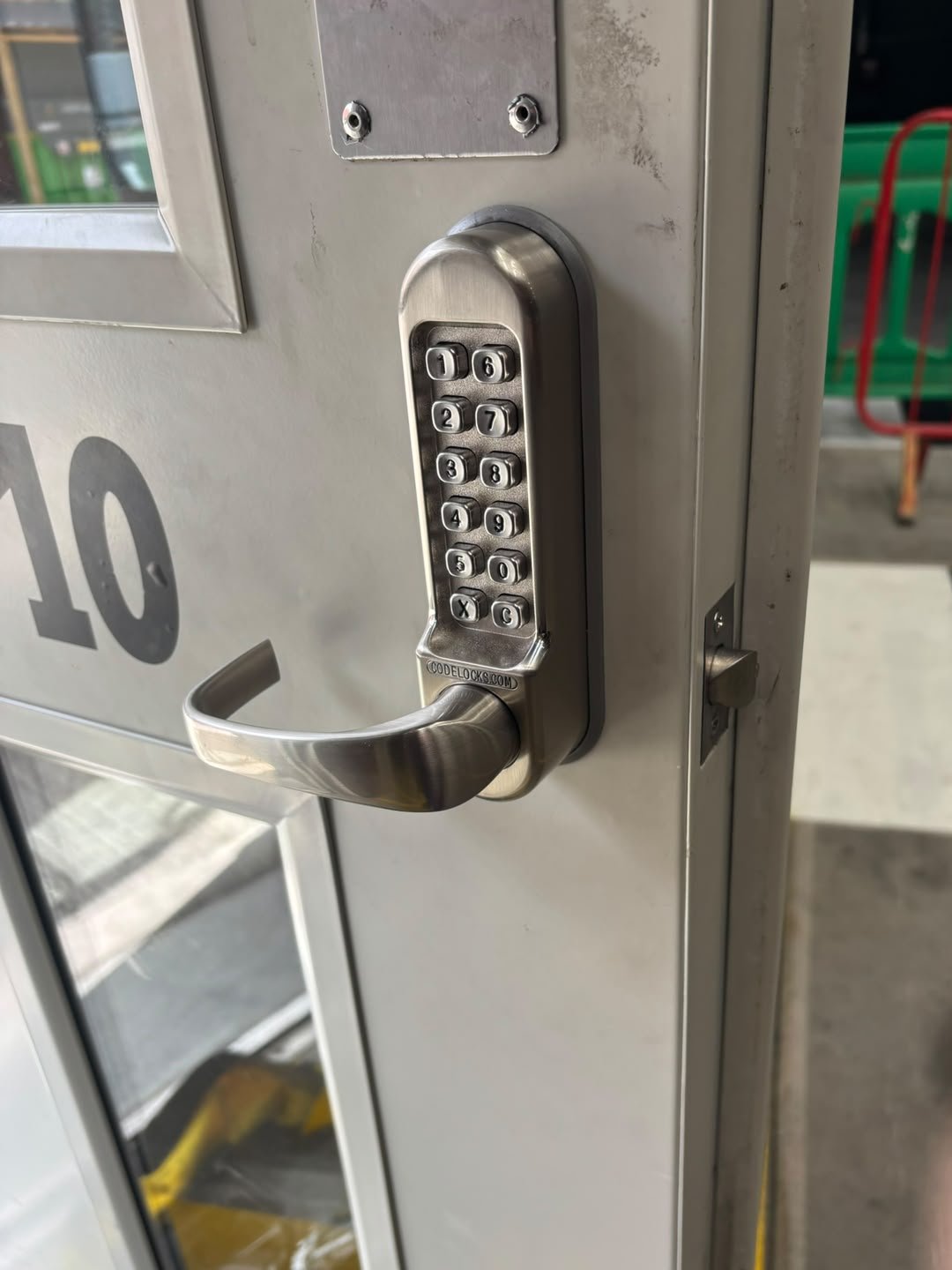 Codelocks keypad lock fitted to a business fire exit door in Denton