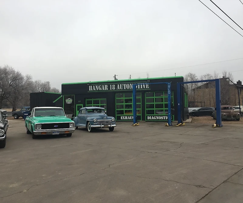 The Hangar 18 Automotive shop building with its garage bays and vehicle lifts in Colorado Springs
