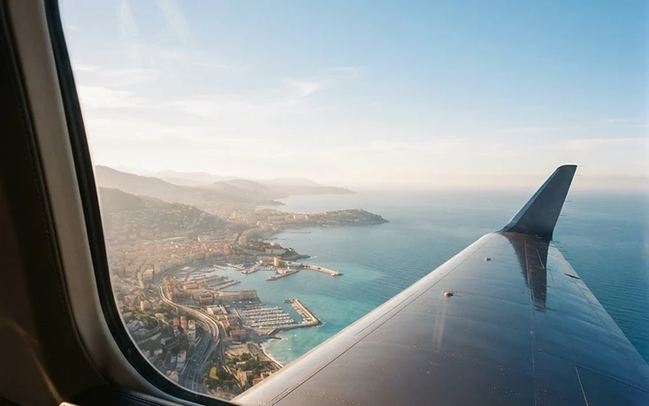 View from a private aircraft over a coastline and city