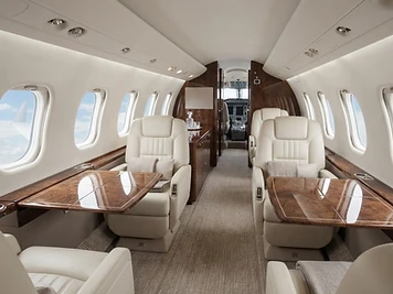 Comfortable cream private aircraft cabin interior