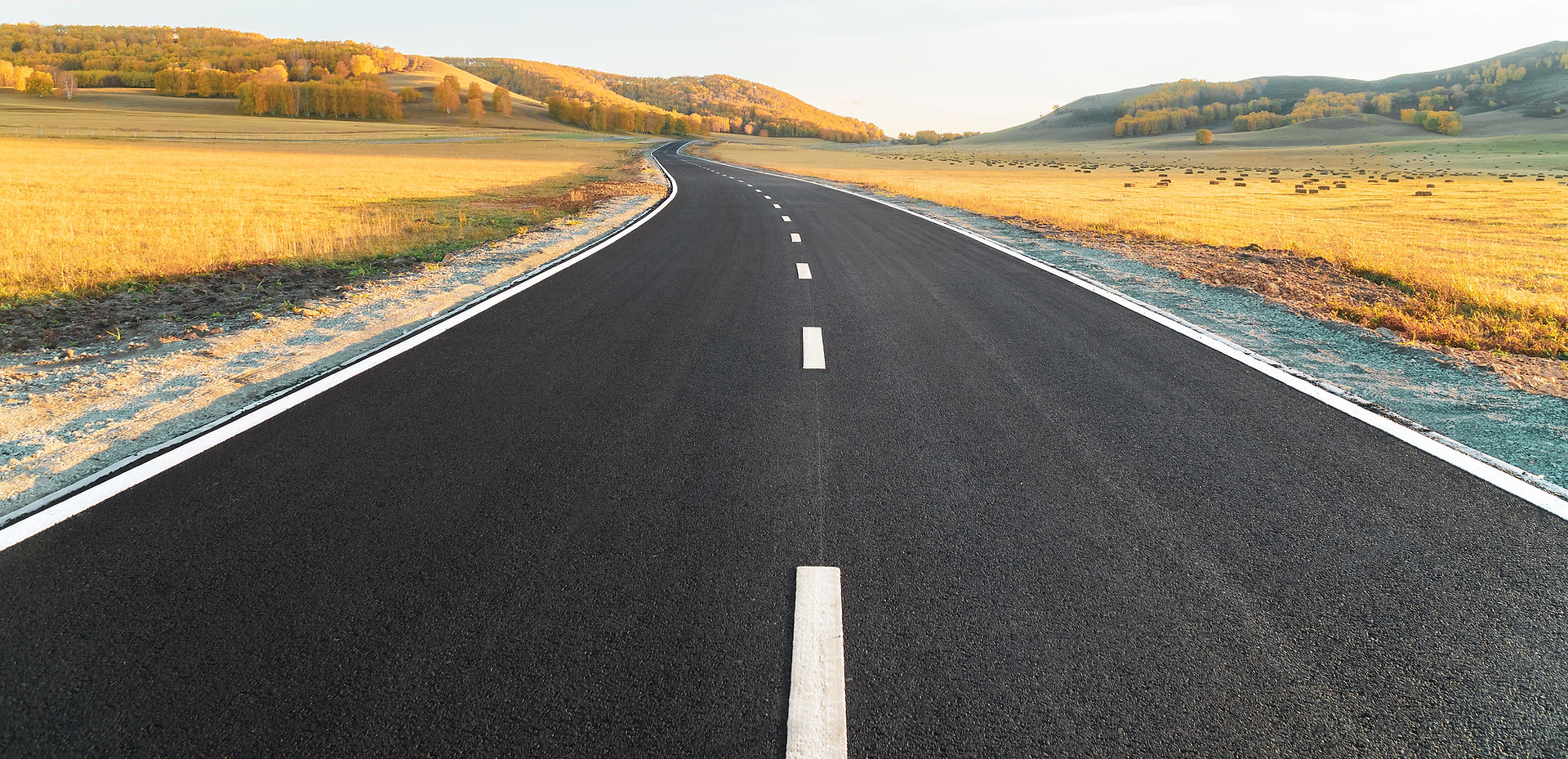 Newly surfaced road leading into the distance