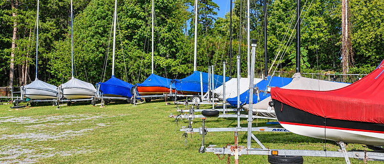 One-design boats stored on trailers at the Jim Cook One Design Center