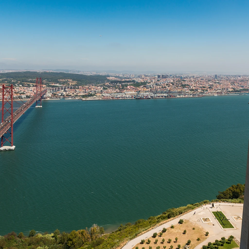 View from the Cristo Rei statue across the Tagus river, the 25 de Abril bridge and the Lisbon skyline
