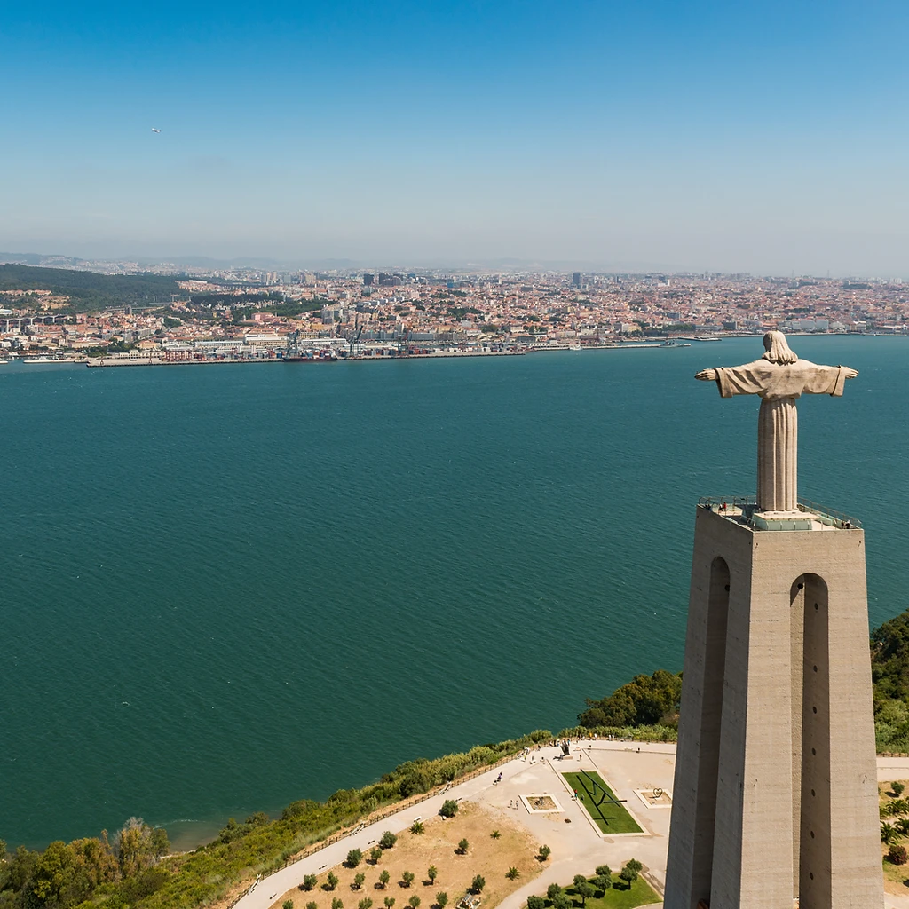View from the Cristo Rei statue across the Tagus river, the 25 de Abril bridge and the Lisbon skyline
