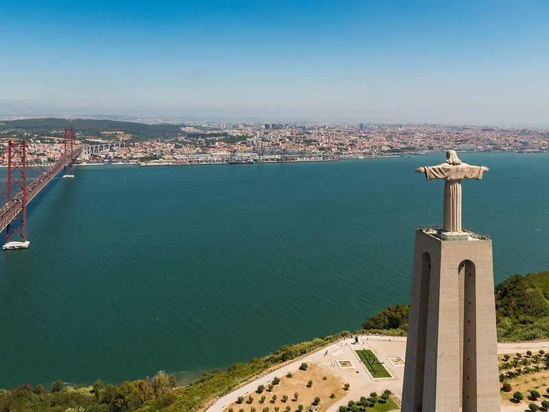 View from the Cristo Rei statue across the Tagus river, the 25 de Abril bridge and the Lisbon skyline
