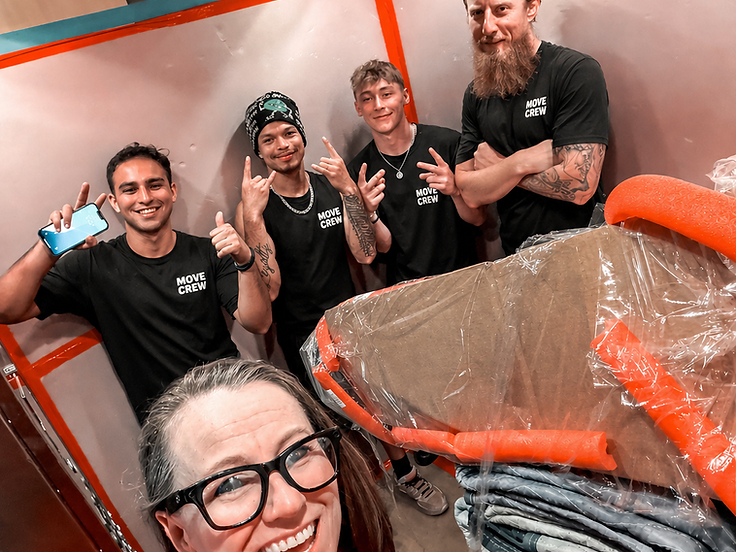 The Lamas Moving crew wrapping furniture for a move
