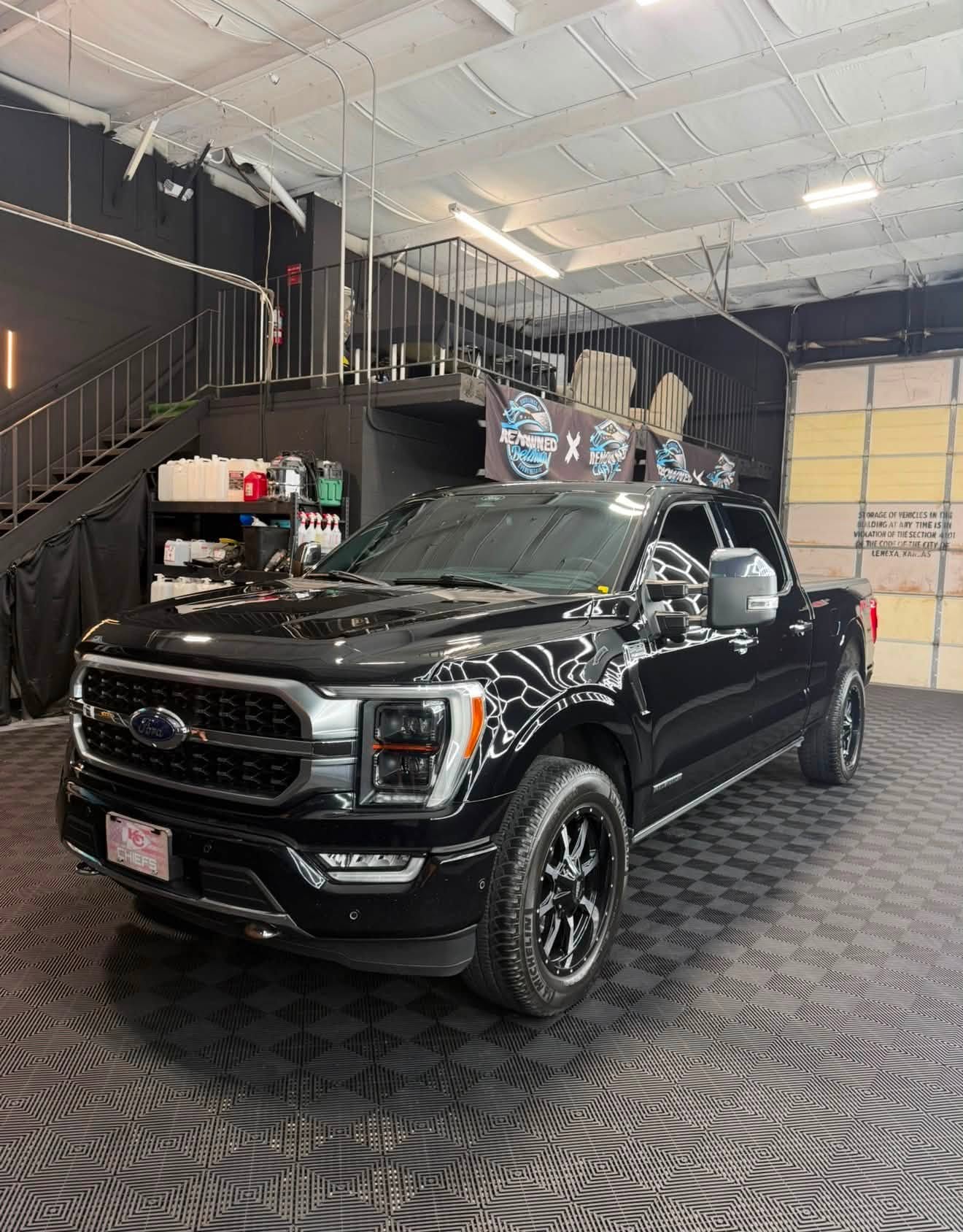 Black F-150 in Lenexa shop — paint correction showcase