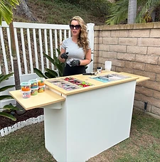 Host preparing slime at the backyard cart