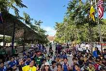 Group of children and adults seated together