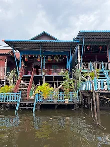 Traditional wooden stilt house over water