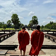 Monks walking toward Angkor Wat