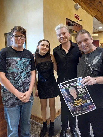 Wesley Upchurch and his son, Taylor Upchurch, with Brian Ledbetter and his stage assistant following a performance of Escape Reality in Branson, Missouri, June 28, 2023.
