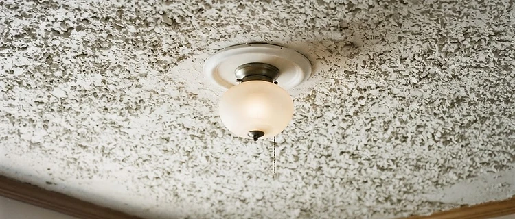 Textured asbestos popcorn ceiling in an older Mobile AL home