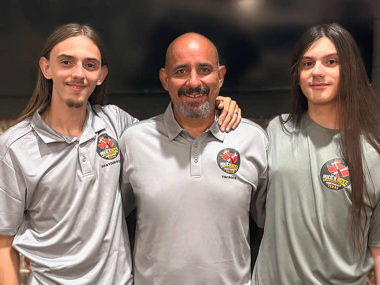 Father and son handyman team working on a home repair in Northeast Texas