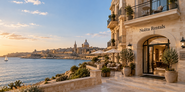 Nolita Rentals waterfront building overlooking Valletta at sunset