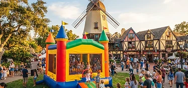 Bounce house set up near Danish-style architecture in Solvang, CA
