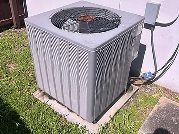 Old outdoor AC condenser before replacement