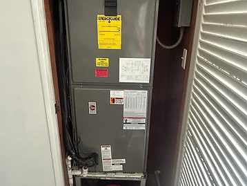 Old air handler in closet before replacement