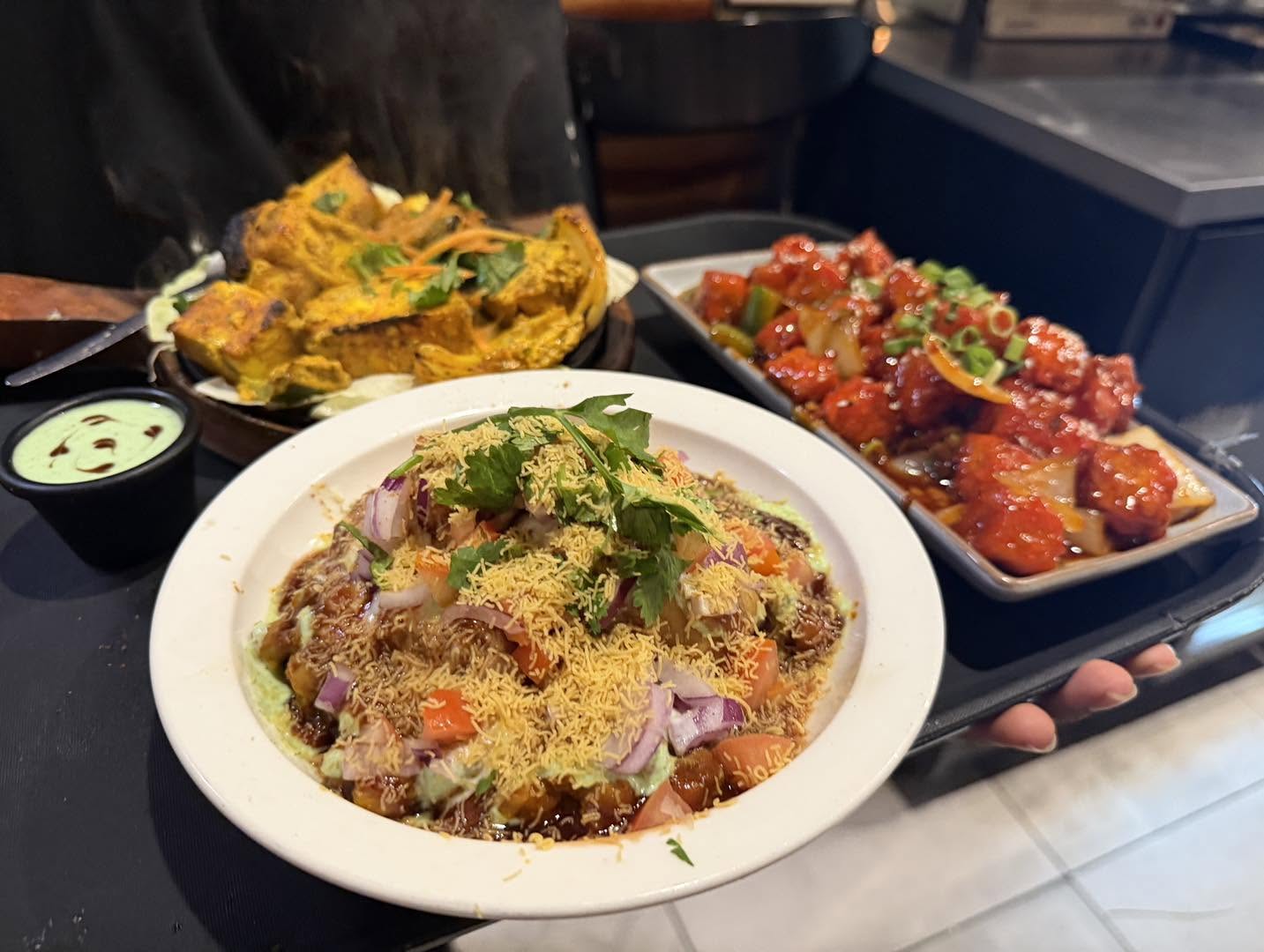 Samosa chaat, paneer tikka and chilli chicken