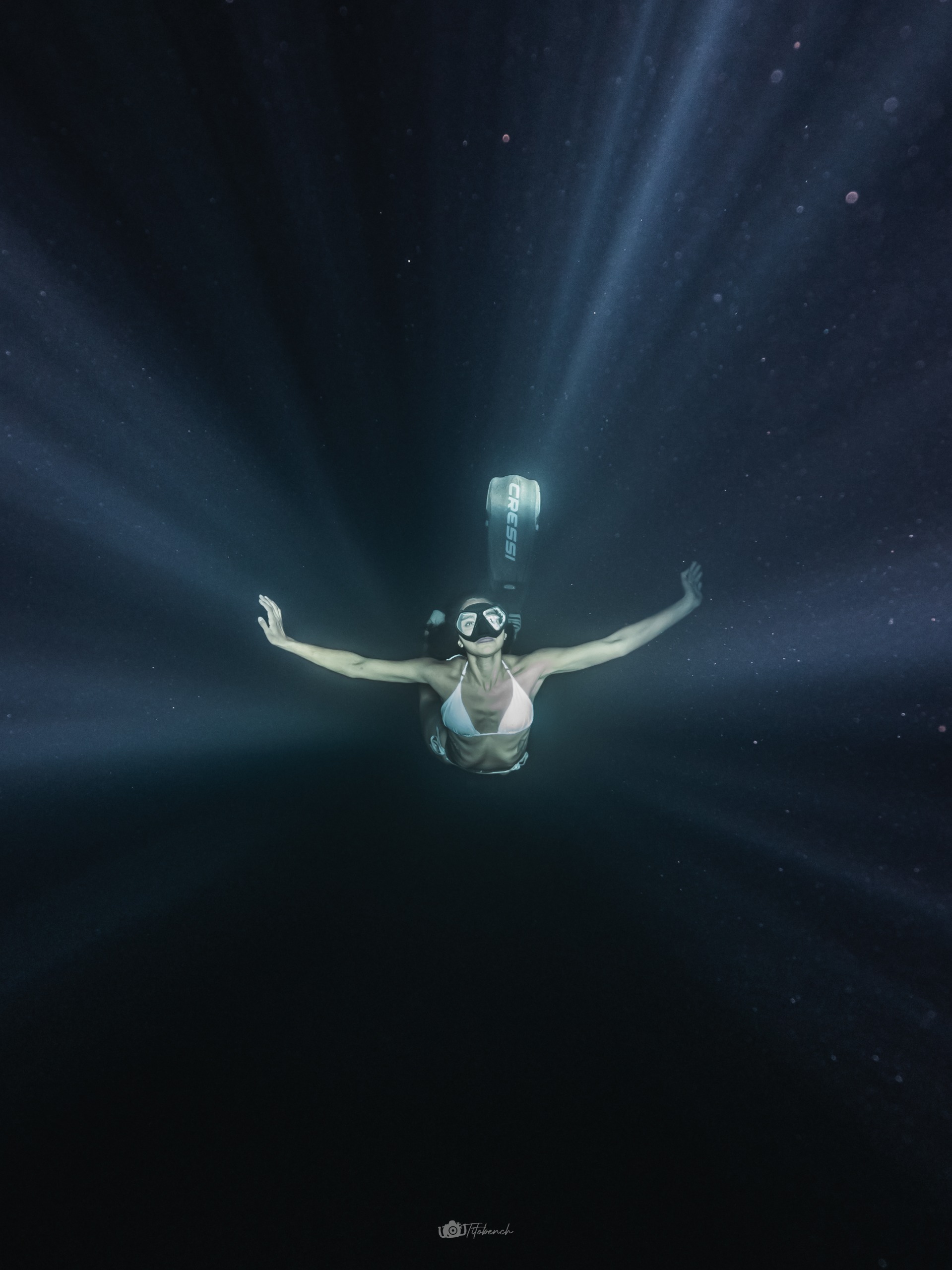 Freediver with arms extended