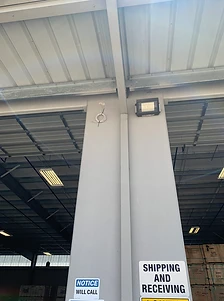 Shipping and receiving entrance with mounted fixture wiring