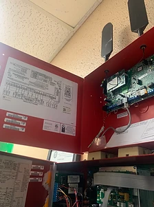 Open fire alarm control panel with cellular communicators