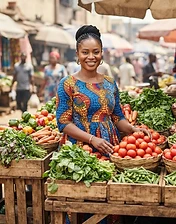 African woman entrepreneur at her fresh vegetable and tomato market stall