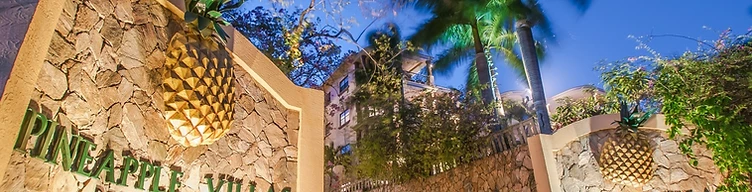Pineapple Villas entrance at dusk