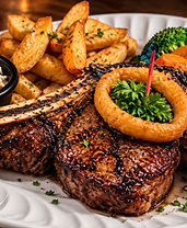 Grilled bone-in ribeye steak with coleslaw, potato wedges and vegetables at Herby's