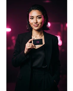 Creator two holding a BaddieTap card