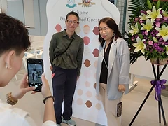 Guests posing at the inauguration welcome board