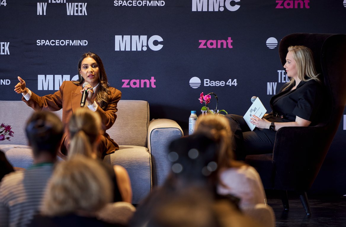 Panelists on stage in front of the Zant and NY Tech Week backdrop
