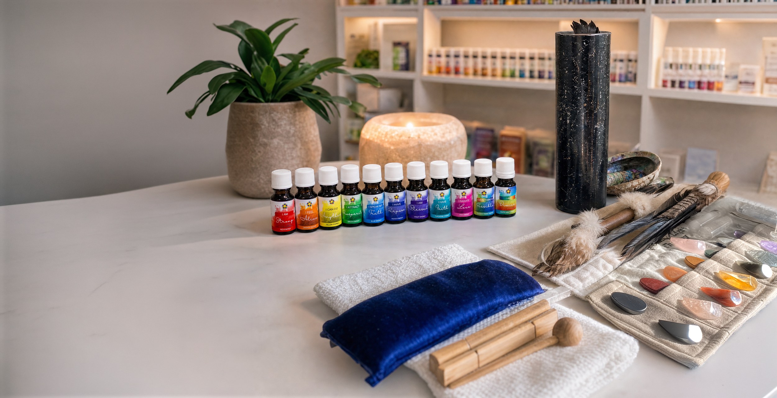 Colour Energy wellness and healing tools arranged on a white marble tabletop