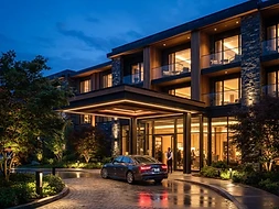 Illuminated hotel entrance at dusk