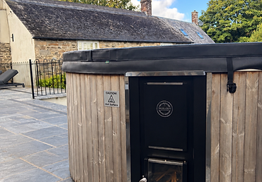 Wood-fired hot tub on a slate patio