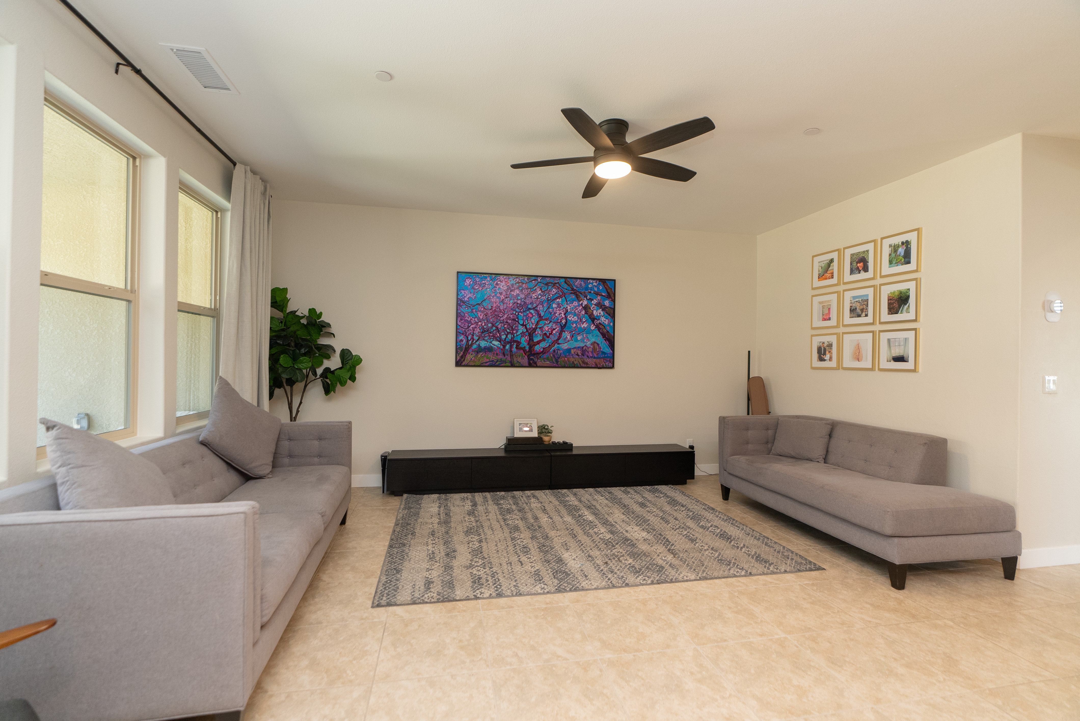 Bright neutral living room with minimalist gallery wall