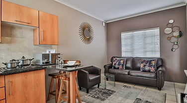 F Block kitchenette and lounge at Rudman Townhouses