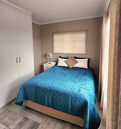Double bedroom with quality bedding at Rudman Townhouses