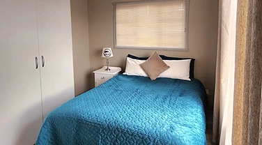 Double bedroom with quality bedding at Rudman Townhouses