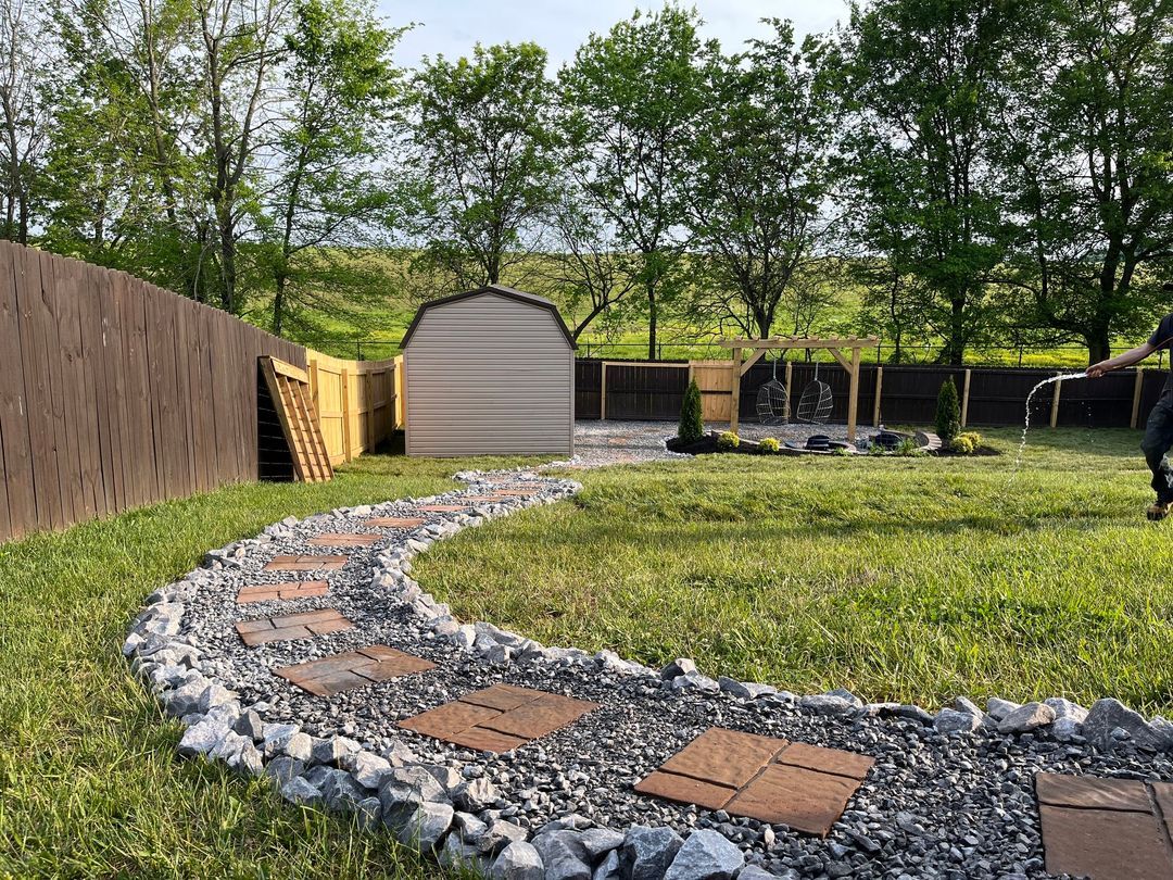 Landscaped backyard with stone path