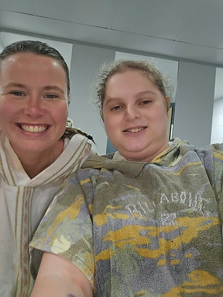 Wrapped in towel ponchos after a swim