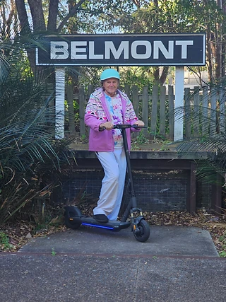 All set to ride the e-scooter past the Belmont sign