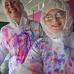 Paint-splattered shirts and big smiles after a spin-art session