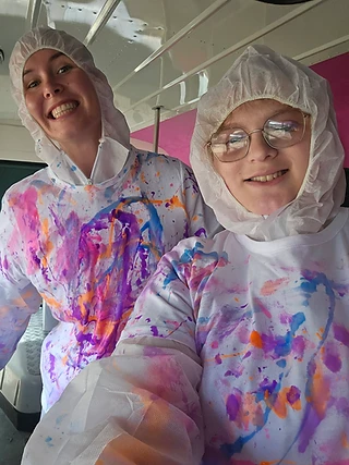Paint-splattered shirts and big smiles after a spin-art session