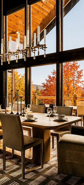 Dining room with fall foliage views, seen in the Unwind guest app