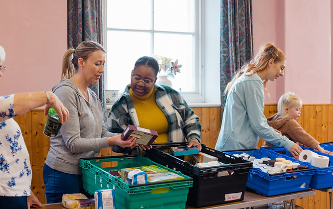 Community volunteers collaborating around a workshop table