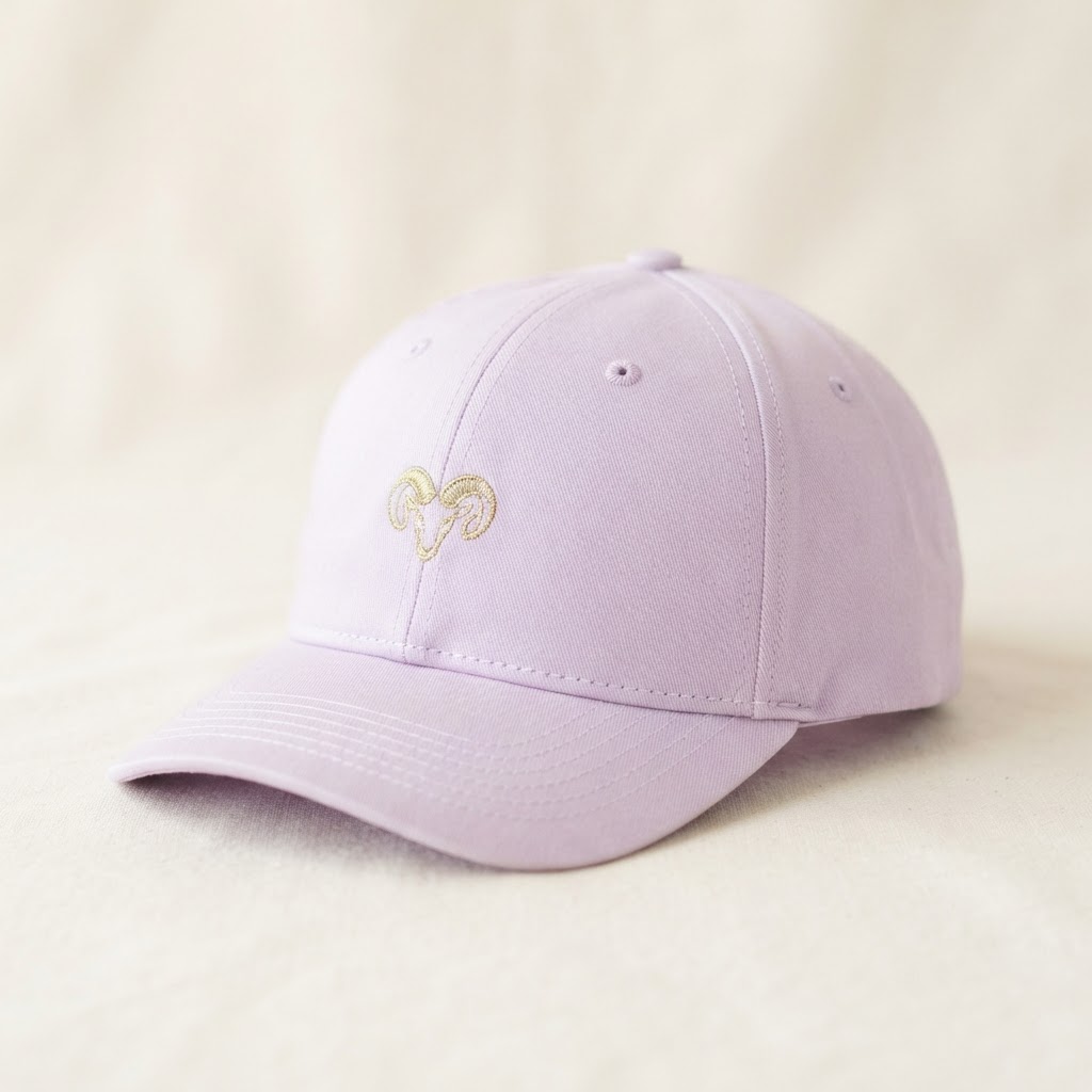 Pale lilac snapback cap with gold ram embroidery